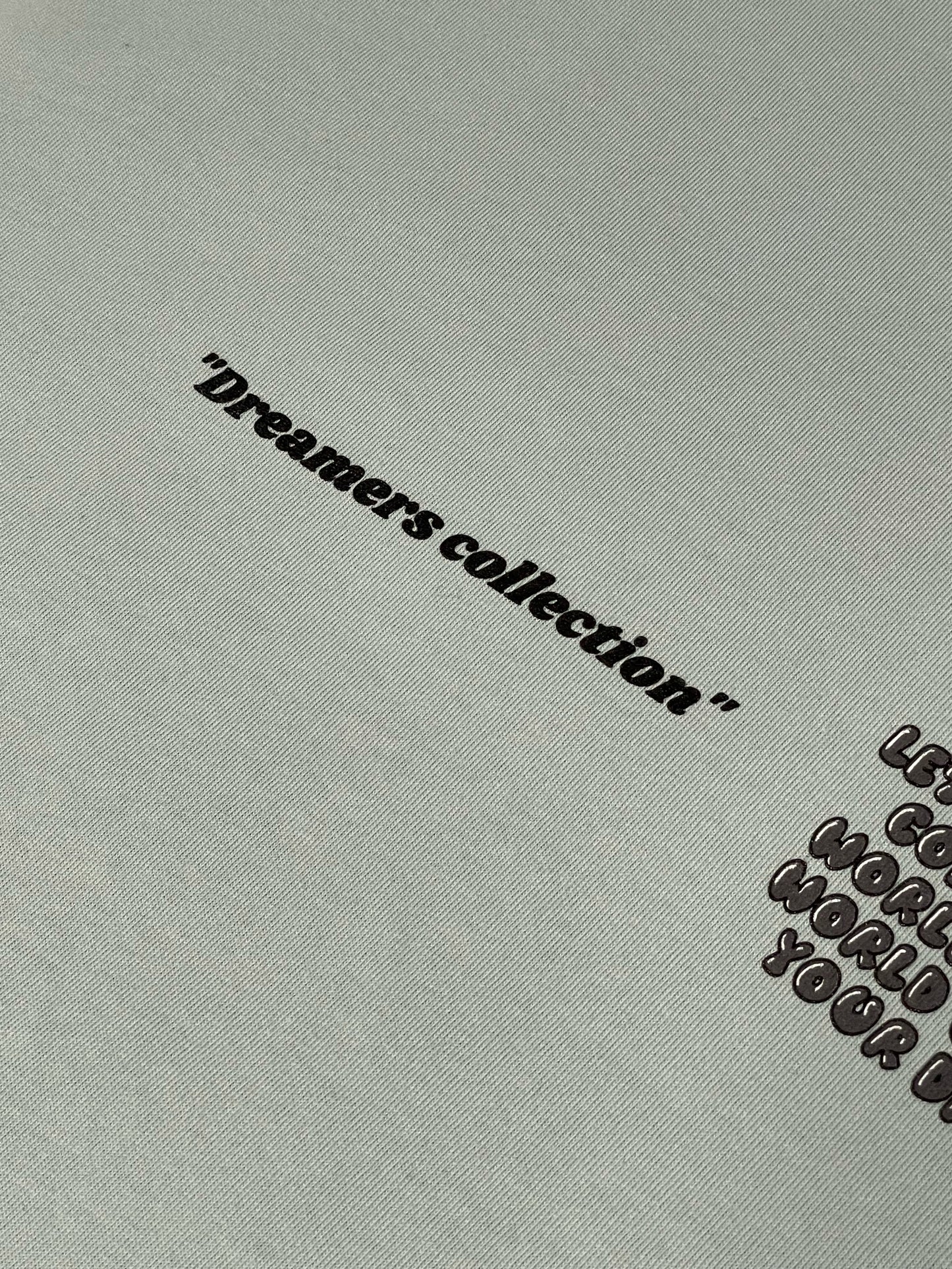 Pastel Blue "Let your dreams conquer the world" tee.