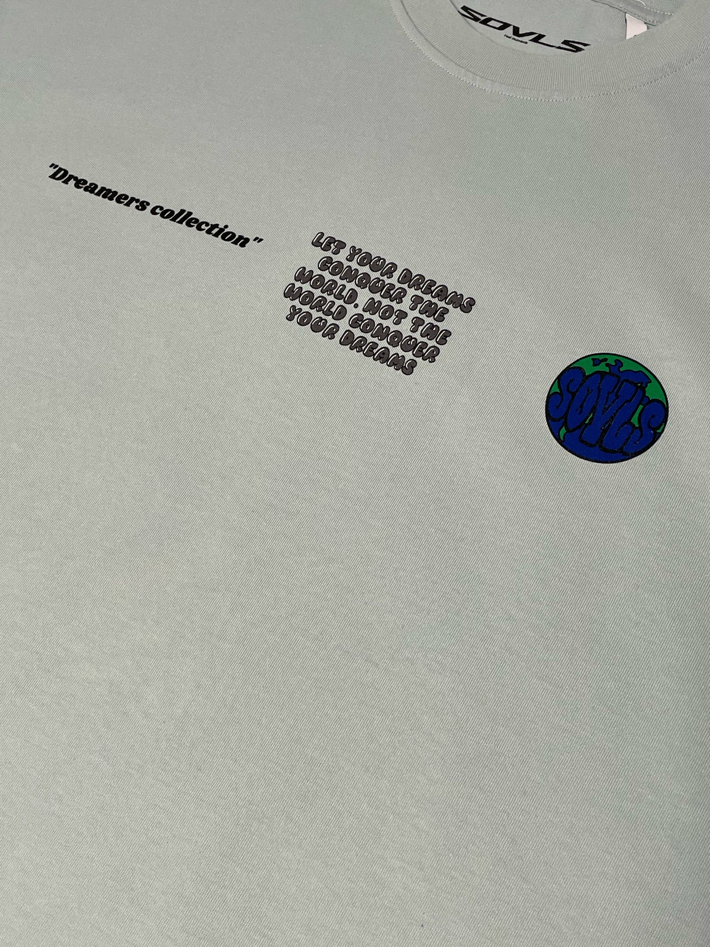 Pastel Blue "Let your dreams conquer the world" tee.