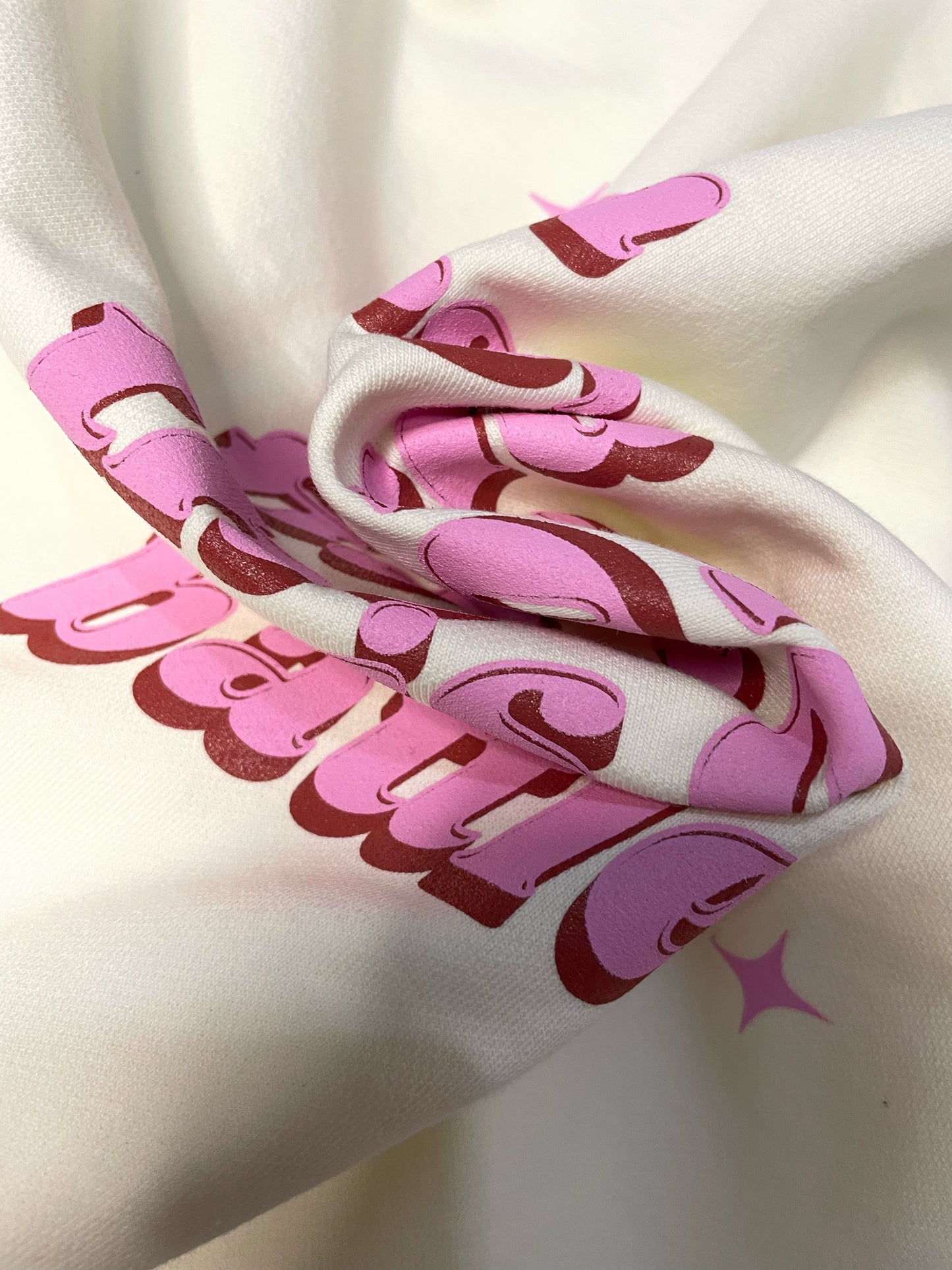 Cream "Feel Human" hoodie.