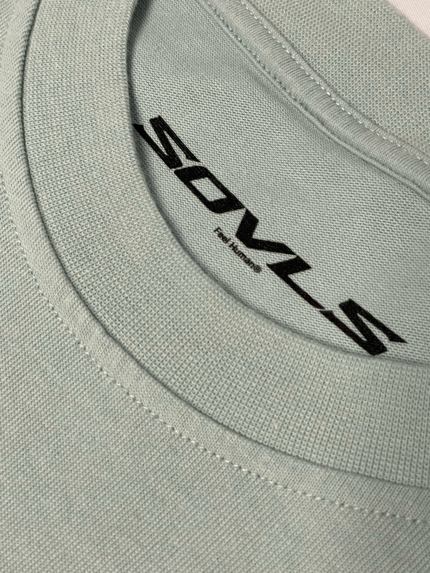 Pastel Blue "Let your dreams conquer the world" tee.